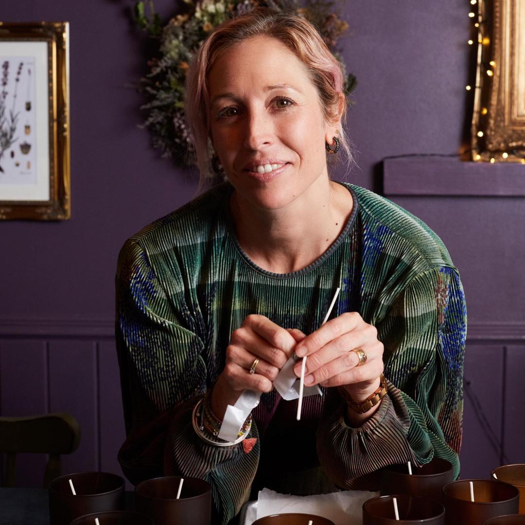 woman smiling holding wicks