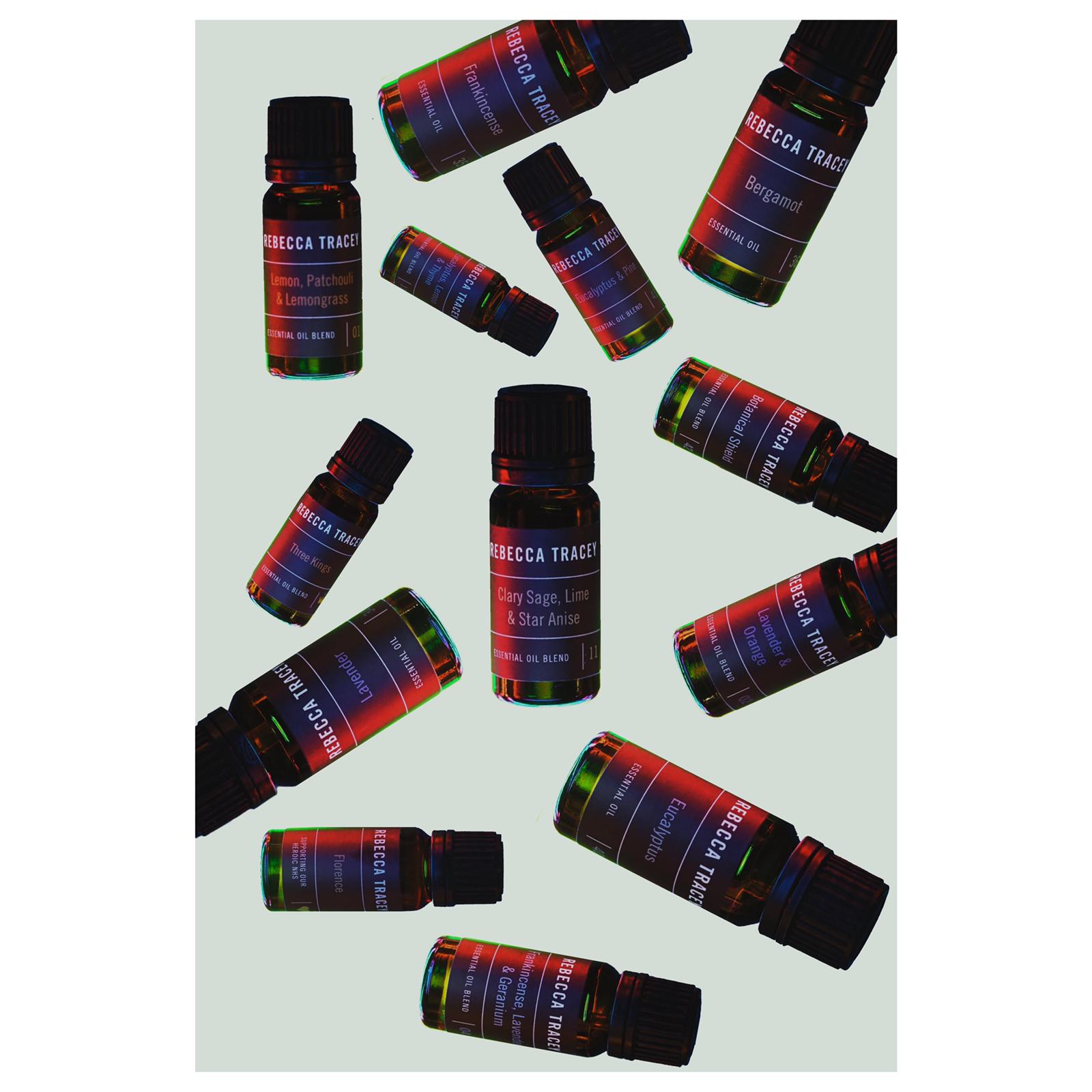 lots of essential oils on a white background